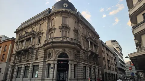 A domed bank on the corner — the grandest thing on the street.