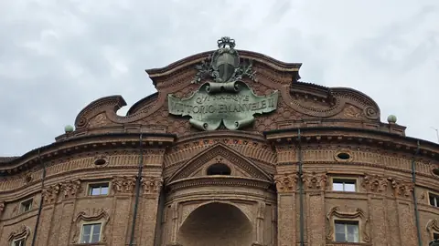 San Lorenzo, brick and baroque on the corner of the square.