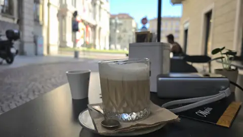 A quiet coffee before a long day.