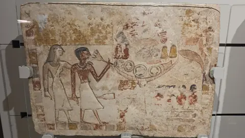 A tomb painting, colours still in it after three thousand years.