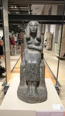 A granite figure at the end of the long gallery.