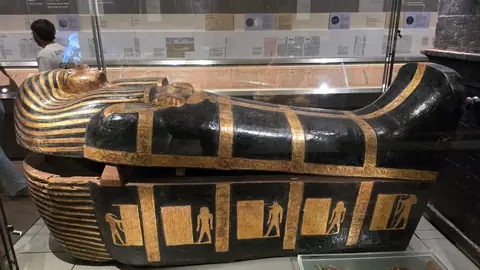 Gilded and black, and in better condition than seems fair.