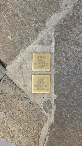 Brass plaques reminding the world of the horrors of fascism.