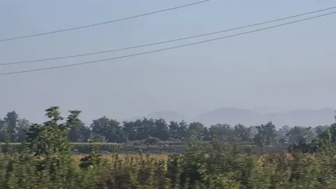 Haze on the fields, and the sun not quite through it.