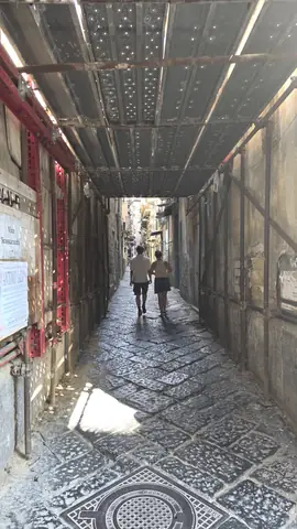 Down an alley, with the tiles still on the floor.