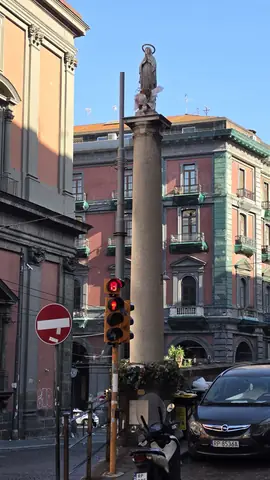 A column with a Madonna on top, mid-junction.