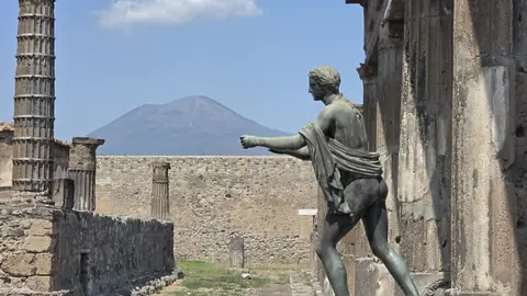 Vesuvius over the top of everything, with a bronze in the foreground.