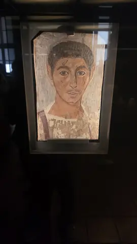A mummy portrait, looking straight out at you.