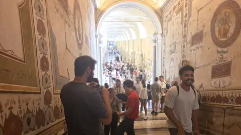 The gallery of statues, and the crowd moving as one animal.