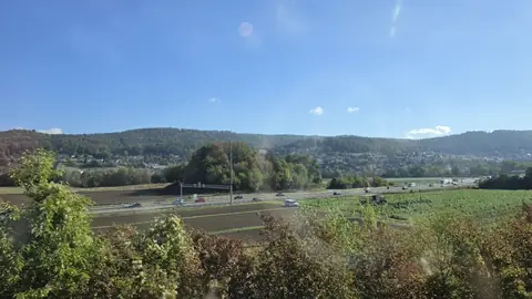 Switzerland going past, doing its best impression of a brochure.