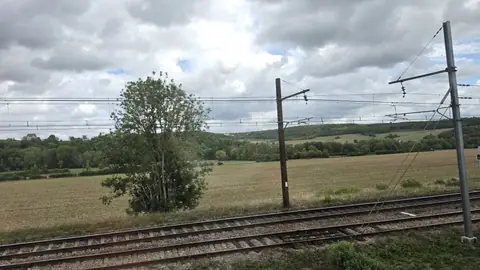 France now, and the country opening out flat.