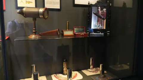 Brass instruments in a case.