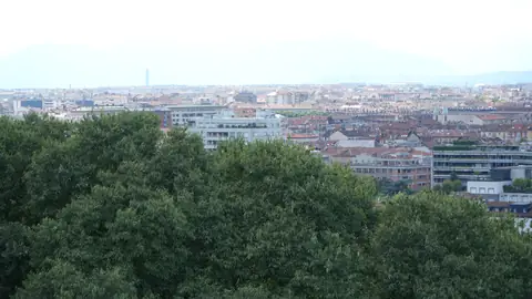Rooftops and hills, all the way out.