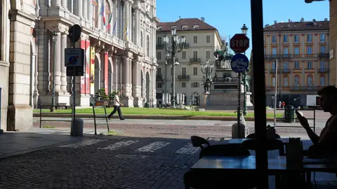 Arcades, and a piazza going quiet.